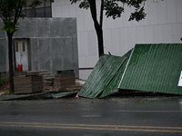 A fence is blown down at a construction site in Nanjing, China, on September 17, 2024. (