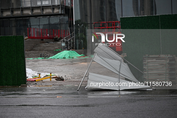 A fence is blown down at a construction site in Nanjing, China, on September 17, 2024. 