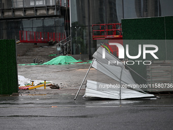 A fence is blown down at a construction site in Nanjing, China, on September 17, 2024. (