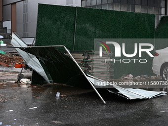 A fence is blown down at a construction site in Nanjing, China, on September 17, 2024. (