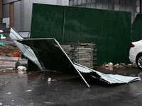 A fence is blown down at a construction site in Nanjing, China, on September 17, 2024. (