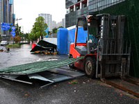 A fence is blown down at a construction site in Nanjing, China, on September 17, 2024. (