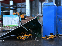 A fence is blown down at a construction site in Nanjing, China, on September 17, 2024. (