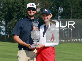 GAINESVILLE, VIRGINIA - SEPTEMBER 15: Sarah Schmelzel of the United States poses with her significant other while holding the trophy after a...