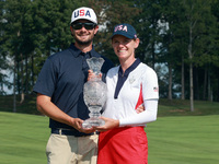 GAINESVILLE, VIRGINIA - SEPTEMBER 15: Sarah Schmelzel of the United States poses with her significant other while holding the trophy after a...