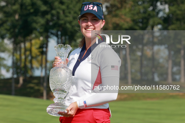 GAINESVILLE, VIRGINIA - SEPTEMBER 15: Lauren Coughlin of the United States holds the winning trophy on the 18th green at the conclusion of t...