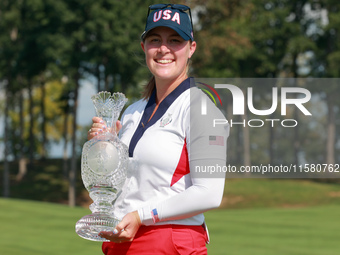 GAINESVILLE, VIRGINIA - SEPTEMBER 15: Lauren Coughlin of the United States holds the winning trophy on the 18th green at the conclusion of t...