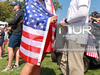 GAINESVILLE, VIRGINIA - SEPTEMBER 15: Allisen Corpuz of the United States celebrates after a Team USA win the Solheim Cup at Robert Trent Jo...