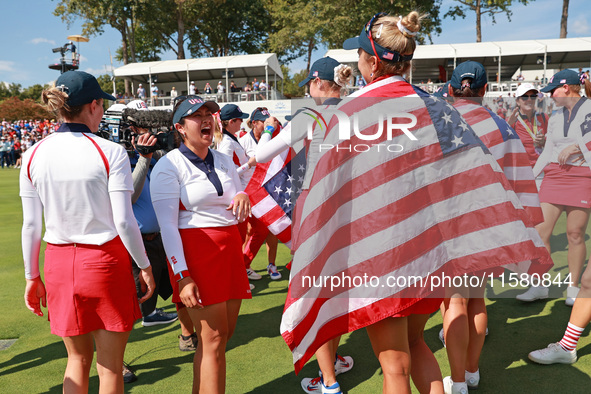 GAINESVILLE, VIRGINIA - SEPTEMBER 15: Lilia Vu of Team USA celebrates with teammates after a Team USA win the Solheim Cup at Robert Trent Jo...