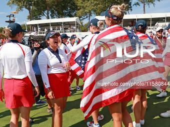 GAINESVILLE, VIRGINIA - SEPTEMBER 15: Lilia Vu of Team USA celebrates with teammates after a Team USA win the Solheim Cup at Robert Trent Jo...