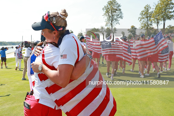 GAINESVILLE, VIRGINIA - SEPTEMBER 15: Lexi Thompson of the United States hugs Vice Captain Angela Stanford after a Team USA win the Solheim...