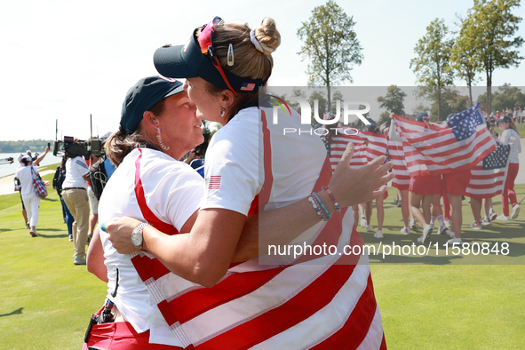 GAINESVILLE, VIRGINIA - SEPTEMBER 15: Lexi Thompson of the United States hugs Vice Captain Angela Stanford after a Team USA win the Solheim...