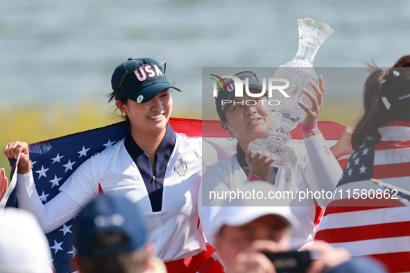 GAINESVILLE, VIRGINIA - SEPTEMBER 15: Lilia Vu of of Team USA holds up the trophy after a Team USA win the Solheim Cup at Robert Trent Jones...