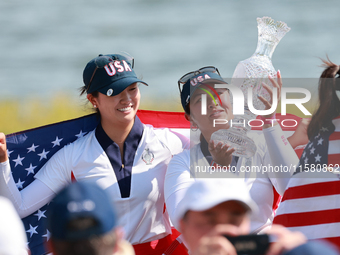 GAINESVILLE, VIRGINIA - SEPTEMBER 15: Lilia Vu of of Team USA holds up the trophy after a Team USA win the Solheim Cup at Robert Trent Jones...