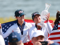 GAINESVILLE, VIRGINIA - SEPTEMBER 15: Lilia Vu of of Team USA holds up the trophy after a Team USA win the Solheim Cup at Robert Trent Jones...