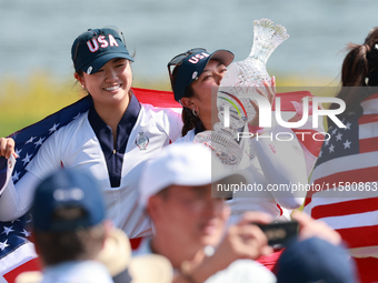 GAINESVILLE, VIRGINIA - SEPTEMBER 15: Lilia Vu of of Team USA kisses the trophy after a Team USA win the Solheim Cup at Robert Trent Jones G...