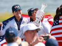 GAINESVILLE, VIRGINIA - SEPTEMBER 15: Lilia Vu of of Team USA kisses the trophy after a Team USA win the Solheim Cup at Robert Trent Jones G...