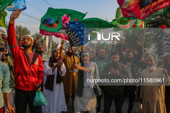 Kashmiri Muslims shout slogans during a rally on the occasion of Eid Milad-un-Nabi, also known as Mawlid, which marks the birth anniversary...