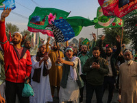 Kashmiri Muslims shout slogans during a rally on the occasion of Eid Milad-un-Nabi, also known as Mawlid, which marks the birth anniversary...