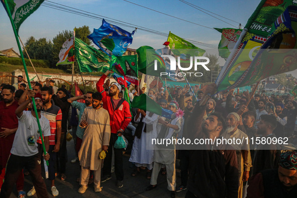 Kashmiri Muslims shout slogans during a rally on the occasion of Eid Milad-un-Nabi, also known as Mawlid, which marks the birth anniversary...