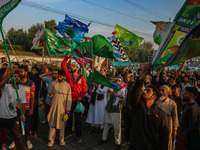 Kashmiri Muslims shout slogans during a rally on the occasion of Eid Milad-un-Nabi, also known as Mawlid, which marks the birth anniversary...