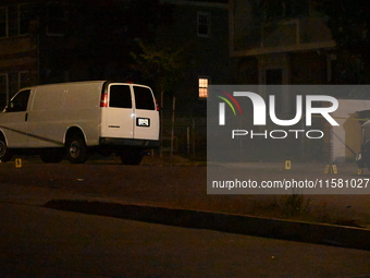 Crime scene investigators collect evidence, mark evidence with evidence markers, and inspect the vehicle airbag with blood on it from the vi...