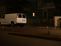 Crime scene investigators collect evidence, mark evidence with evidence markers, and inspect the vehicle airbag with blood on it from the vi...