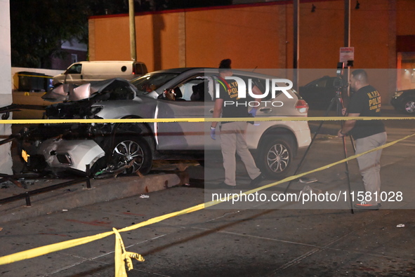 Crime scene investigators collect evidence, mark evidence with evidence markers, and inspect the vehicle airbag with blood on it from the vi...