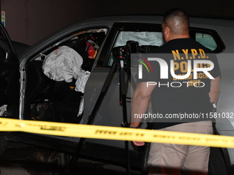 Crime scene investigators collect evidence, mark evidence with evidence markers, and inspect the vehicle airbag with blood on it from the vi...