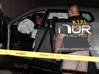 Crime scene investigators collect evidence, mark evidence with evidence markers, and inspect the vehicle airbag with blood on it from the vi...