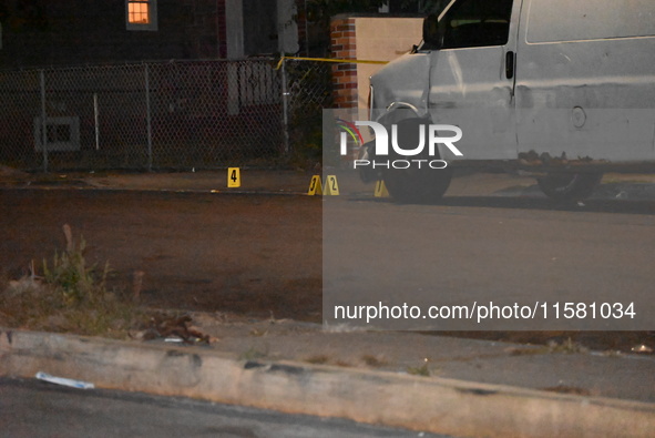 Crime scene investigators collect evidence, mark evidence with evidence markers, and inspect the vehicle airbag with blood on it from the vi...