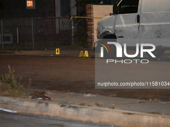 Crime scene investigators collect evidence, mark evidence with evidence markers, and inspect the vehicle airbag with blood on it from the vi...