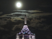 A supermoon appears over the Porcelain Tower of Nanjing in Nanjing, China, on September 17, 2024. (