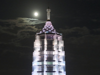 A supermoon appears over the Porcelain Tower of Nanjing in Nanjing, China, on September 17, 2024. (