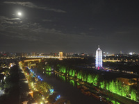 A supermoon appears over the Porcelain Tower of Nanjing in Nanjing, China, on September 17, 2024. (