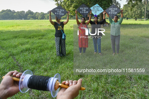 People fly kites with protest slogans written on them during a kite festival in Kolkata, India, on September 17, 2024. The rape and murder c...