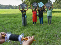 People fly kites with protest slogans written on them during a kite festival in Kolkata, India, on September 17, 2024. The rape and murder c...