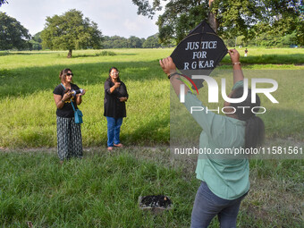 People fly kites with protest slogans written on them during a kite festival in Kolkata, India, on September 17, 2024. The rape and murder c...