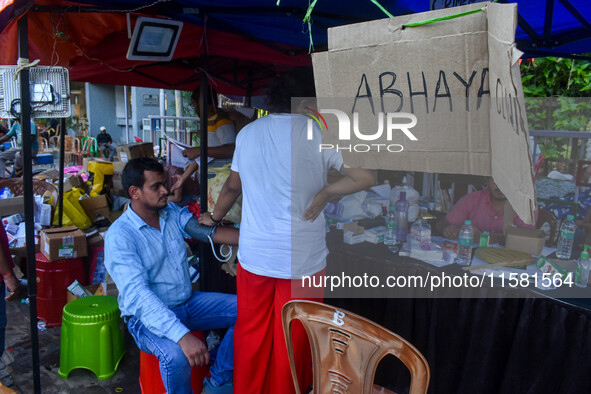 A doctor consults at a free clinic named ''Abhaya Clinic'' at the doctors' agitation site in front of the Health Ministry head office in Kol...