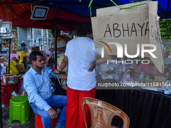 A doctor consults at a free clinic named ''Abhaya Clinic'' at the doctors' agitation site in front of the Health Ministry head office in Kol...