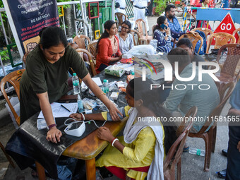 A doctor consults at a free clinic named ''Abhaya Clinic'' at the doctors' agitation site in front of the Health Ministry head office in Kol...