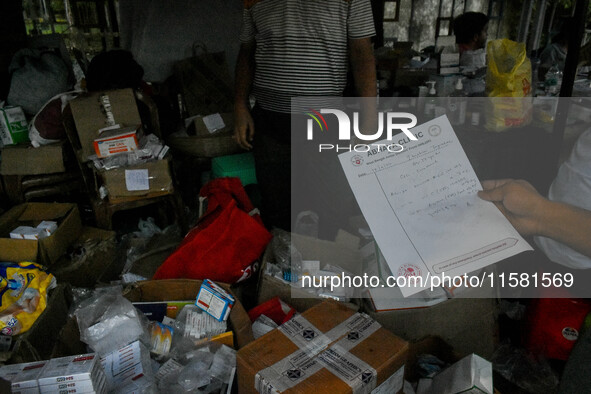 A patient collects free medicine from a free clinic named ''Abhaya Clinic'' at the doctors' agitation site in front of the Health Ministry h...