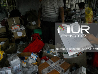 A patient collects free medicine from a free clinic named ''Abhaya Clinic'' at the doctors' agitation site in front of the Health Ministry h...