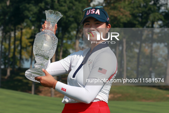 GAINESVILLE, VIRGINIA - SEPTEMBER 15: Rose Zhang of the United States poses with the trophy after a Team USA win at the conclusion of the So...