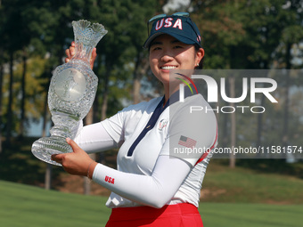 GAINESVILLE, VIRGINIA - SEPTEMBER 15: Rose Zhang of the United States poses with the trophy after a Team USA win at the conclusion of the So...