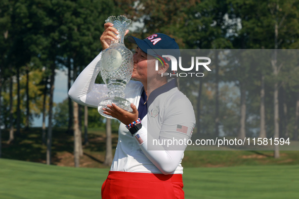 GAINESVILLE, VIRGINIA - SEPTEMBER 15: Allisen Corpuz of the United States kisses the trophy after a Team USA win at the conclusion of the So...