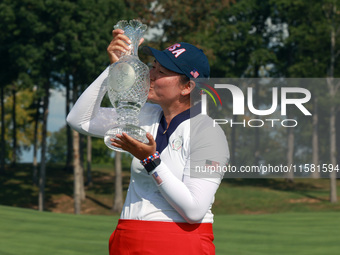 GAINESVILLE, VIRGINIA - SEPTEMBER 15: Allisen Corpuz of the United States kisses the trophy after a Team USA win at the conclusion of the So...