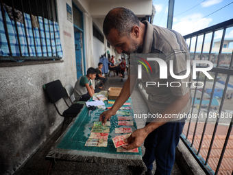 The Palestinian Yasser Abu Harbid, a 50-year-old displaced from northern Gaza to Deir al-Balah, lives in a school run by the United Nations...