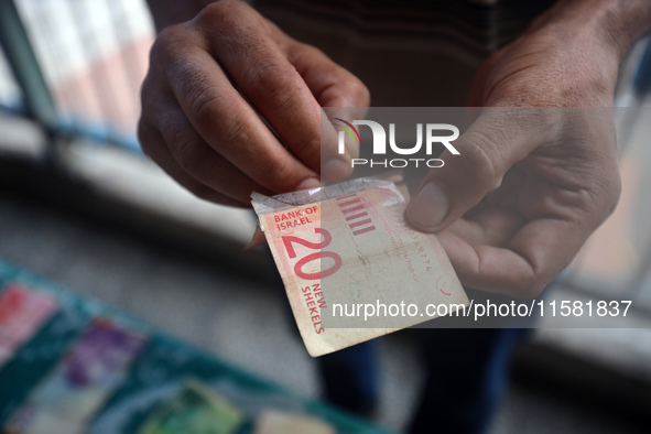 The Palestinian Yasser Abu Harbid, a 50-year-old displaced from northern Gaza to Deir al-Balah, lives in a school run by the United Nations...