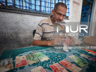 The Palestinian Yasser Abu Harbid, a 50-year-old displaced from northern Gaza to Deir al-Balah, lives in a school run by the United Nations...